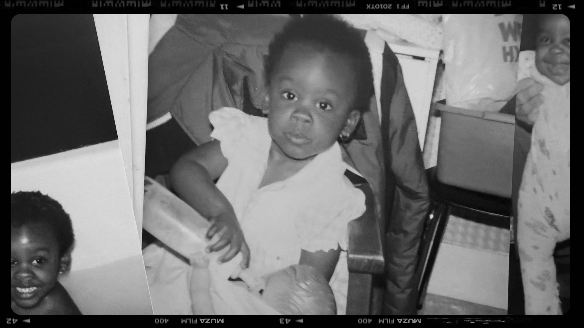 A black-and-white childhood photo of a young girl holding a bottle, used as the hero image for the story She Used to Talk to Herself — a story about loneliness and finding her voice.