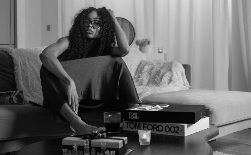 Bess Obarotimi seated on a sofa, speaking about why she wrote I AM Success for her audience.